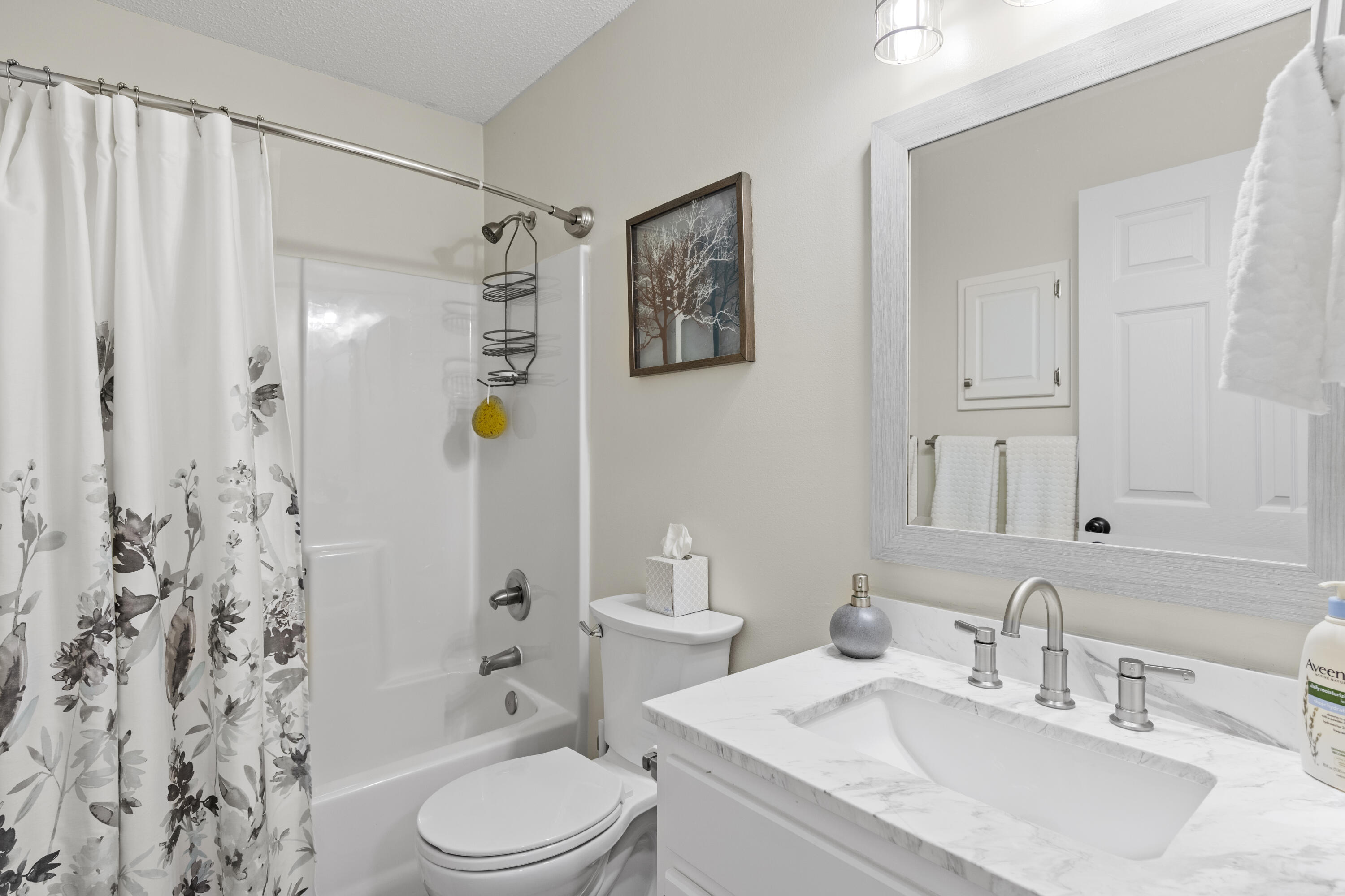 2852 Atoka Trail Crestview, FL 32539 - Photo 34 of 45 a bathroom with a sink toilet and shower