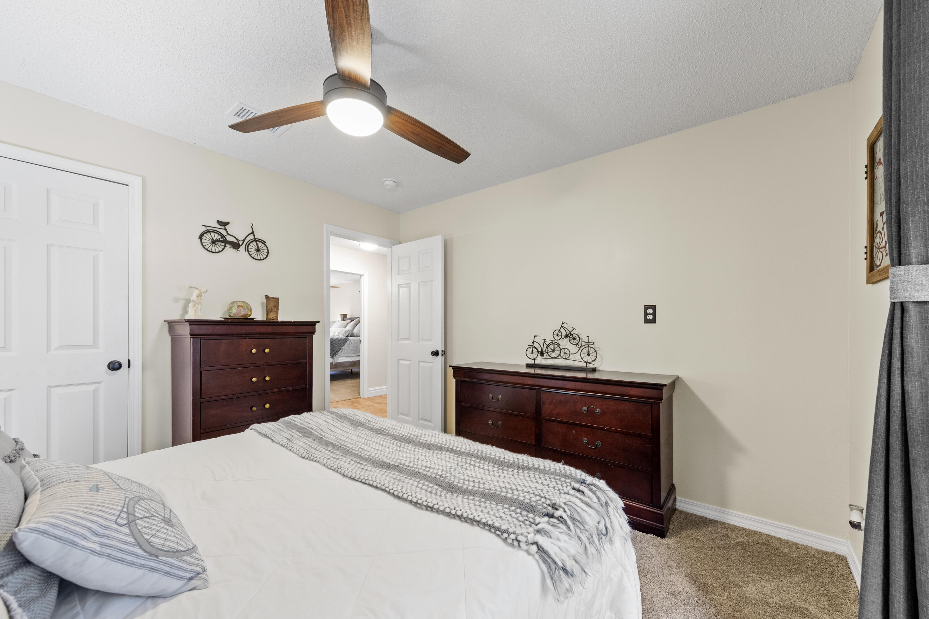 2852 Atoka Trail Crestview, FL 32539 - Photo 36 of 45 a bedroom with a bed and a dresser