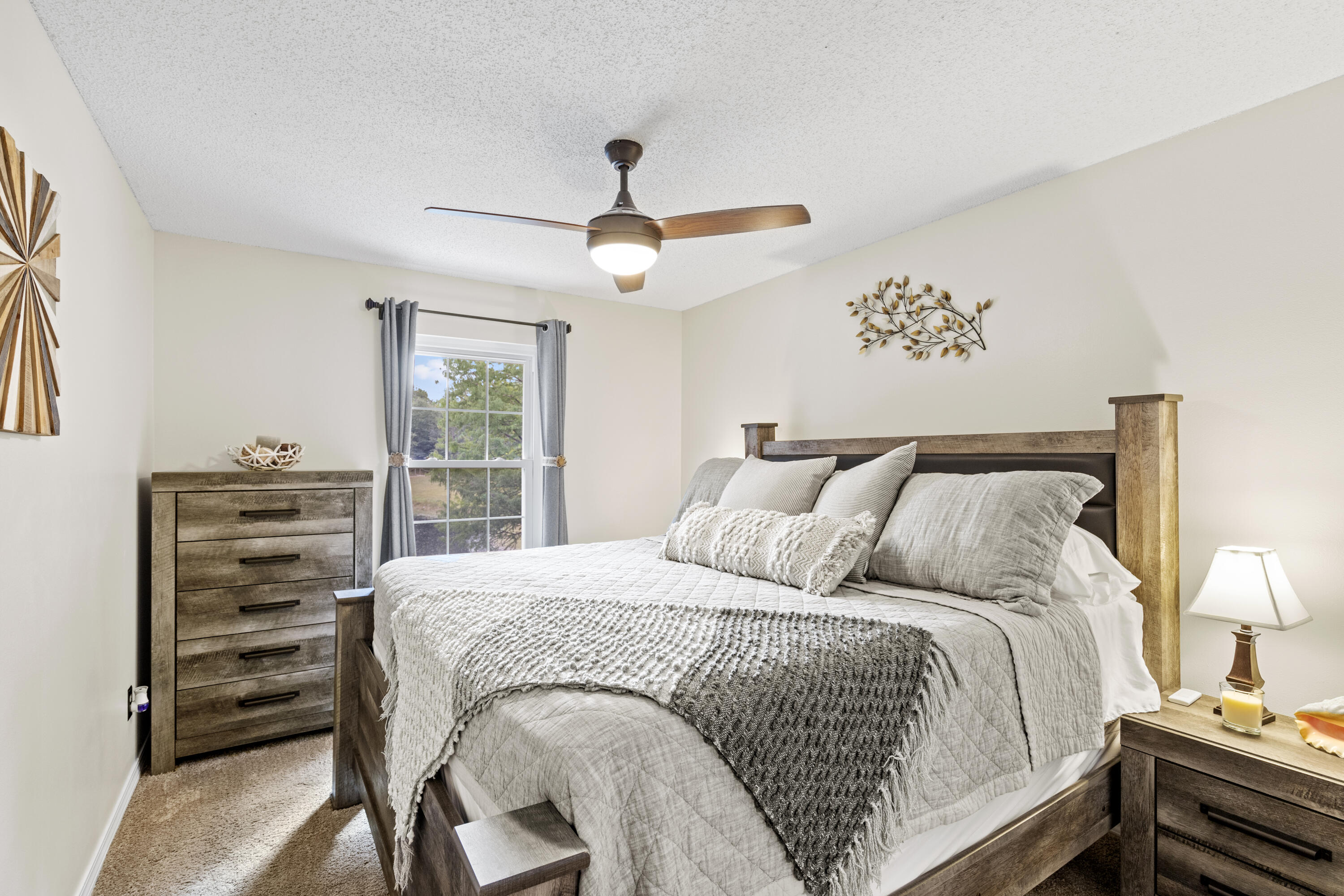 2852 Atoka Trail Crestview, FL 32539 - Photo 37 of 45 a bedroom with a bed and a chandelier