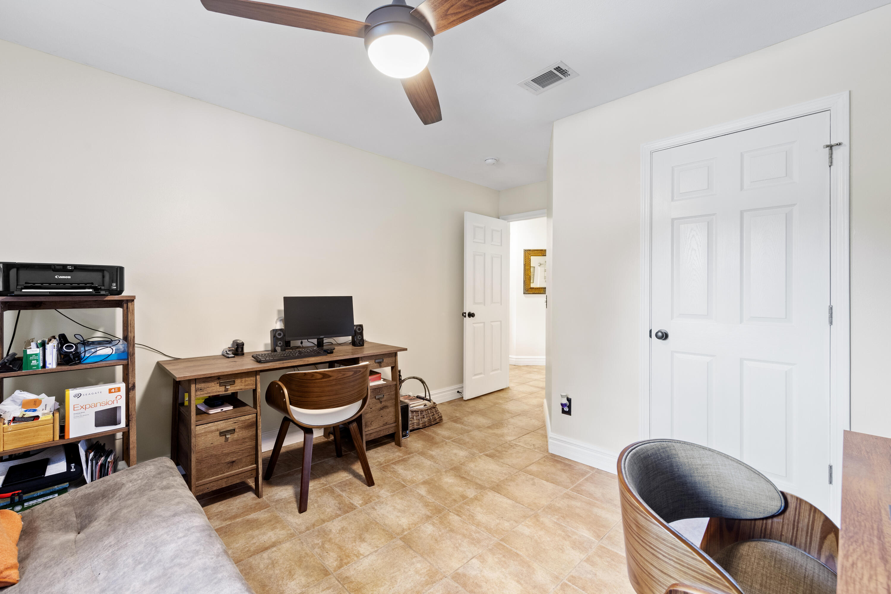 2852 Atoka Trail Crestview, FL 32539 - Photo 39 of 45 a living room with furniture and a flat screen tv