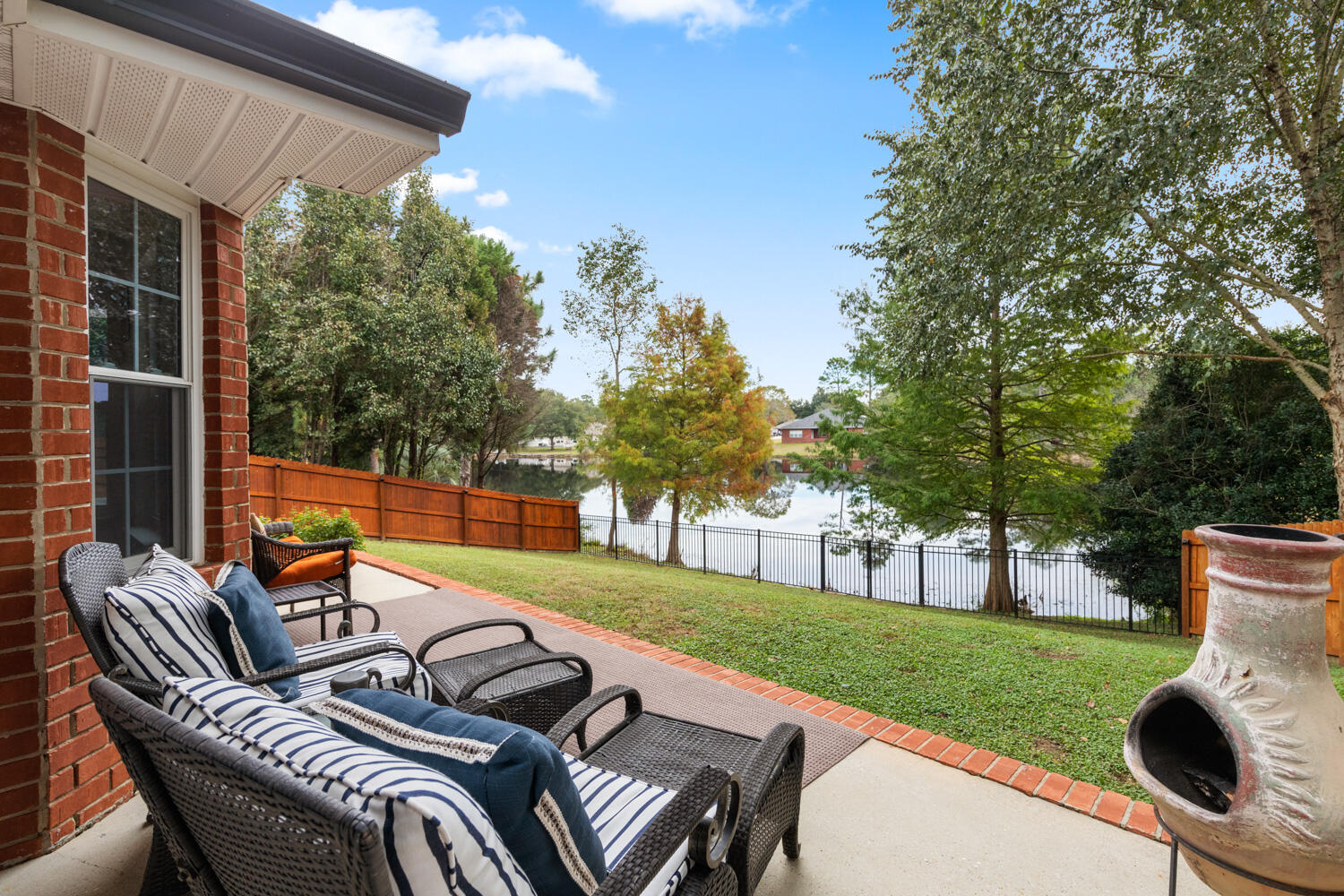 2852 Atoka Trail Crestview, FL 32539 - Photo 8 of 45 a backyard of a house with table and chairs