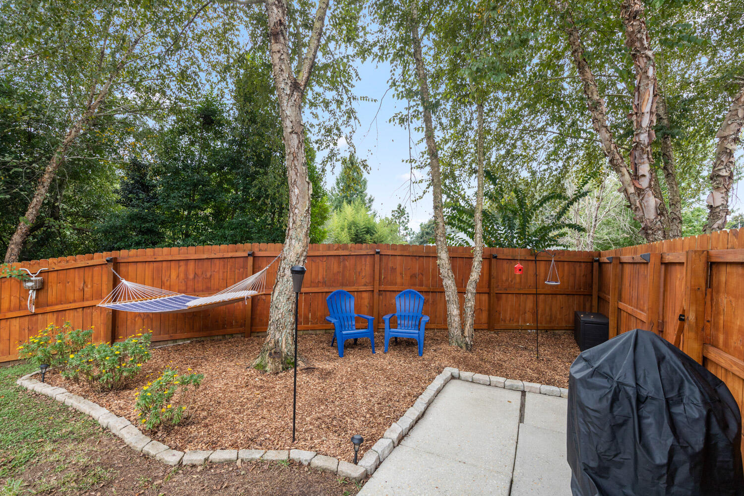 2852 Atoka Trail Crestview, FL 32539 - Photo 9 of 45 a view of a backyard with sitting area