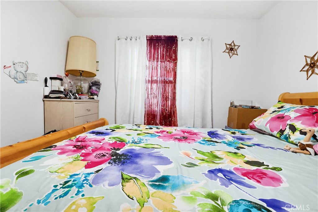 924 West 134th Place Compton, CA 90222 - Photo 22 of 45 a bedroom with a bed and a dresser