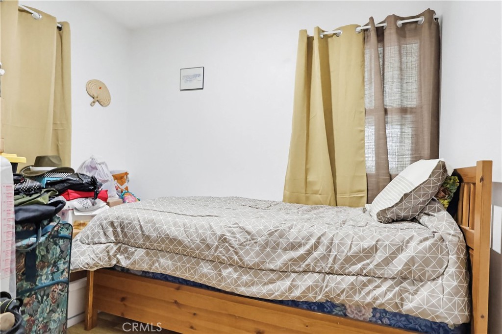924 West 134th Place Compton, CA 90222 - Photo 25 of 45 a bedroom with a bed and a window
