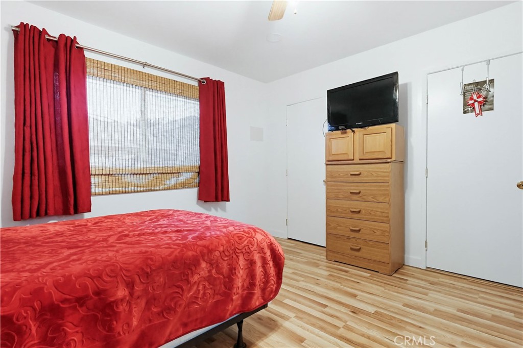 924 West 134th Place Compton, CA 90222 - Photo 28 of 45 a bed sitting in a bedroom next to a window