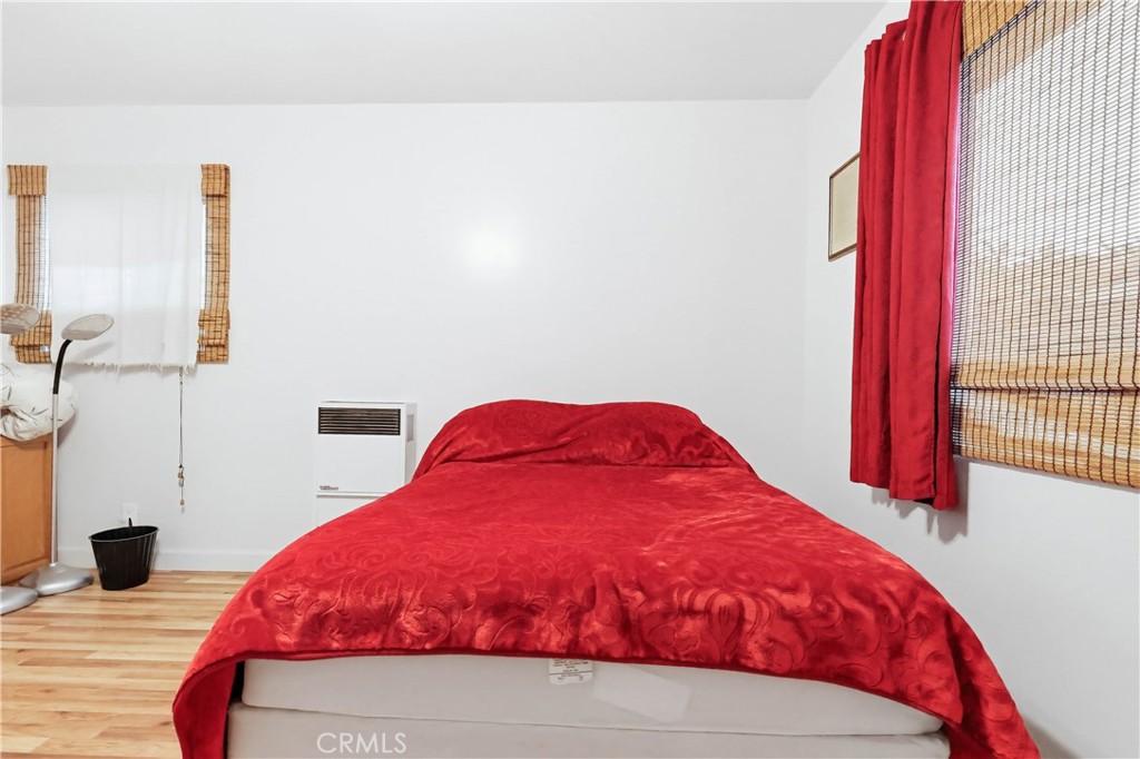 924 West 134th Place Compton, CA 90222 - Photo 29 of 45 a bedroom with a bed and a flat screen tv