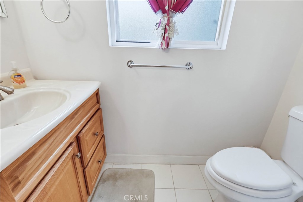 924 West 134th Place Compton, CA 90222 - Photo 31 of 45 a bathroom with a sink a toilet and shower