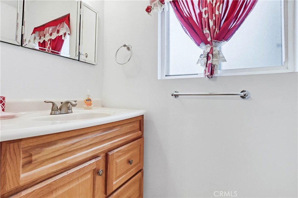 924 West 134th Place Compton, CA 90222 - Photo 32 of 45 a bathroom with a sink and a mirror