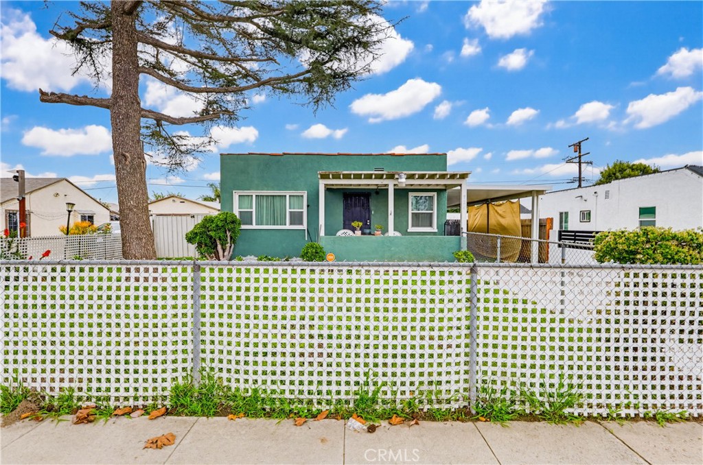 924 West 134th Place Compton, CA 90222 - Photo 4 of 45 a front view of a house with a garden