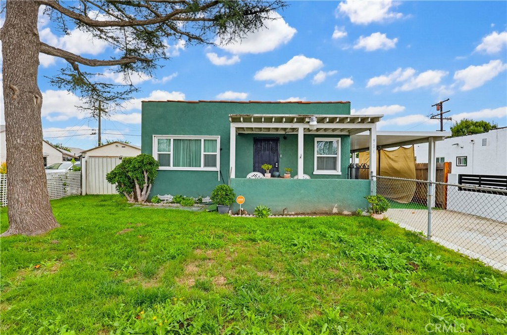 924 West 134th Place Compton, CA 90222 - Photo 9 of 45 a front view of a house with a yard