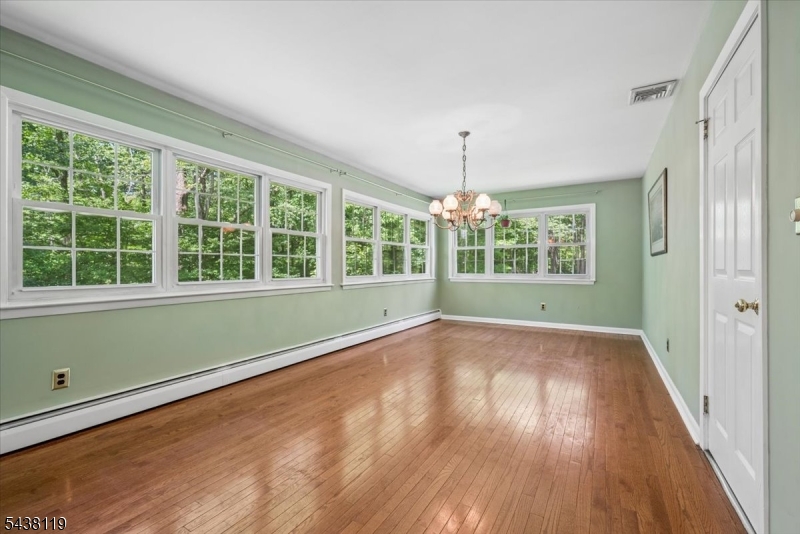 335 Drakestown Road Long Valley, NJ 07853 - Photo 16 of 34 a view of an empty room with wooden floor and a window