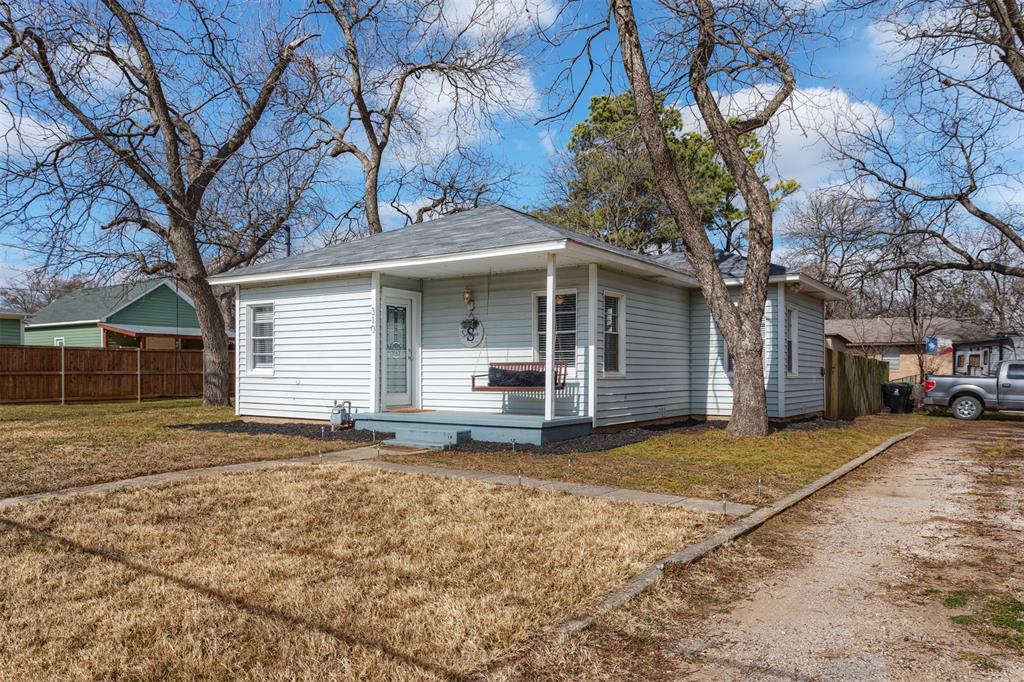 310 East Liberty Street Pilot Point, TX 76258 - Photo 1 of 1 a view of a house with a yard