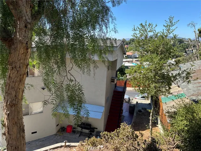 a backyard of a house with lots of green space