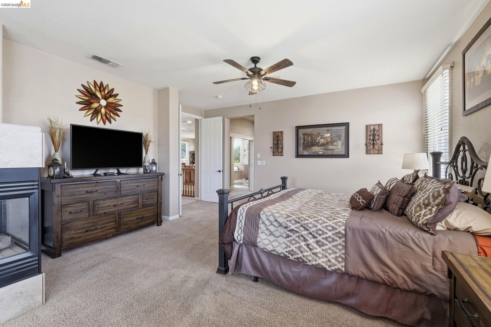 3438 Keystone Loop Discovery Bay, CA 94505 - Photo 23 of 57 a bedroom with a bed and a flat screen tv