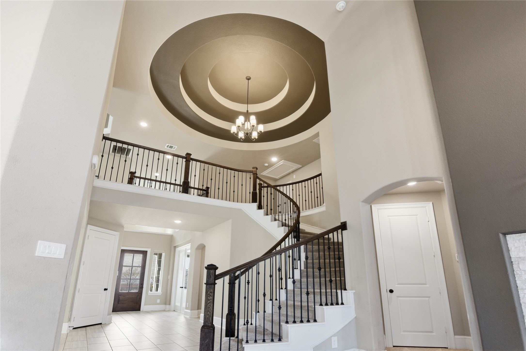 a view of entryway and hall with a front door