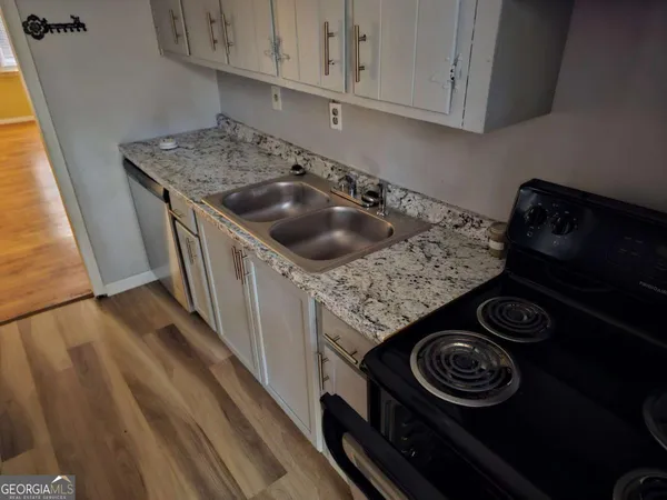 a kitchen with a stove and a sink