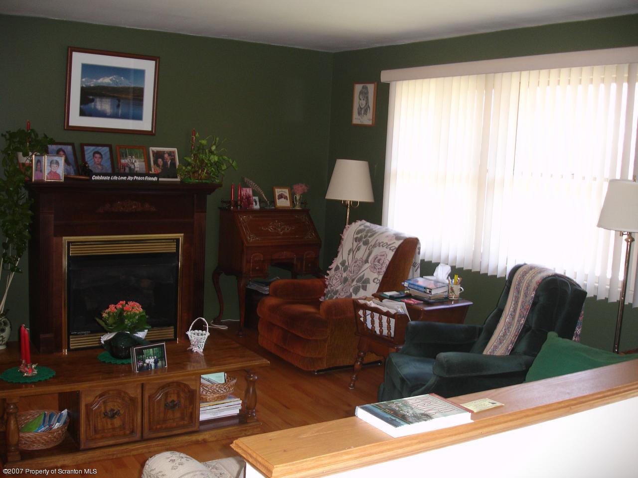 4575 Pumphouse Rd Lake Lake Ariel, PA 18436 - Photo 3 of 13 a living room with furniture and a fireplace
