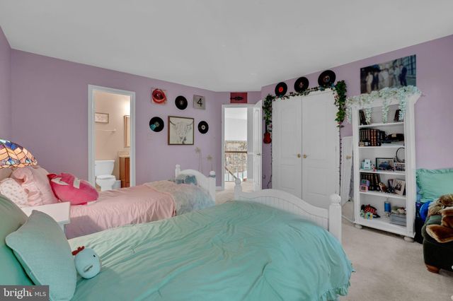 a bedroom with a bed and a walk in closet