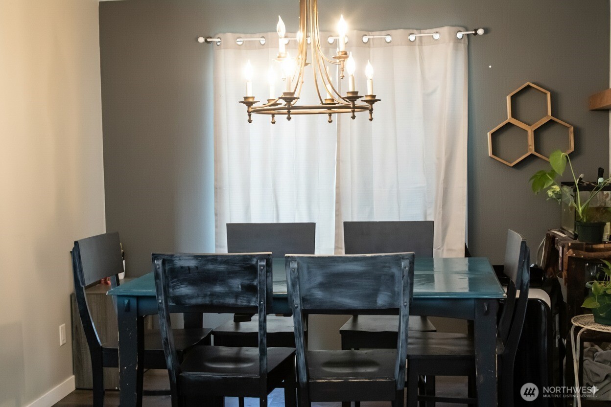 217 Noble Street Sumas, WA 98295 - Photo 4 of 19 a view of a dining room with furniture and wooden floor