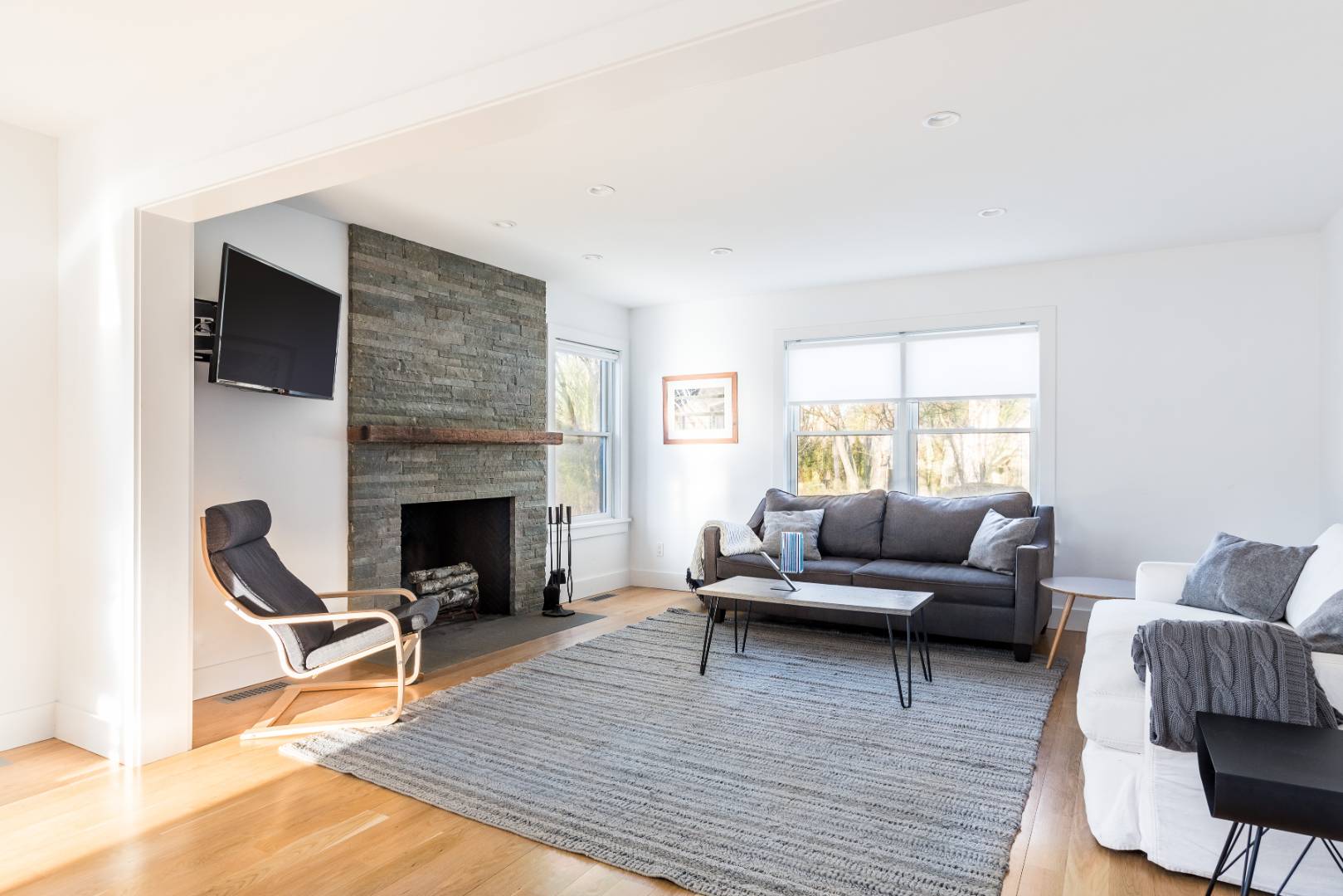 87 Accabonac Road East Hampton, NY 11937 - Photo 2 of 20 a living room with furniture and a fireplace