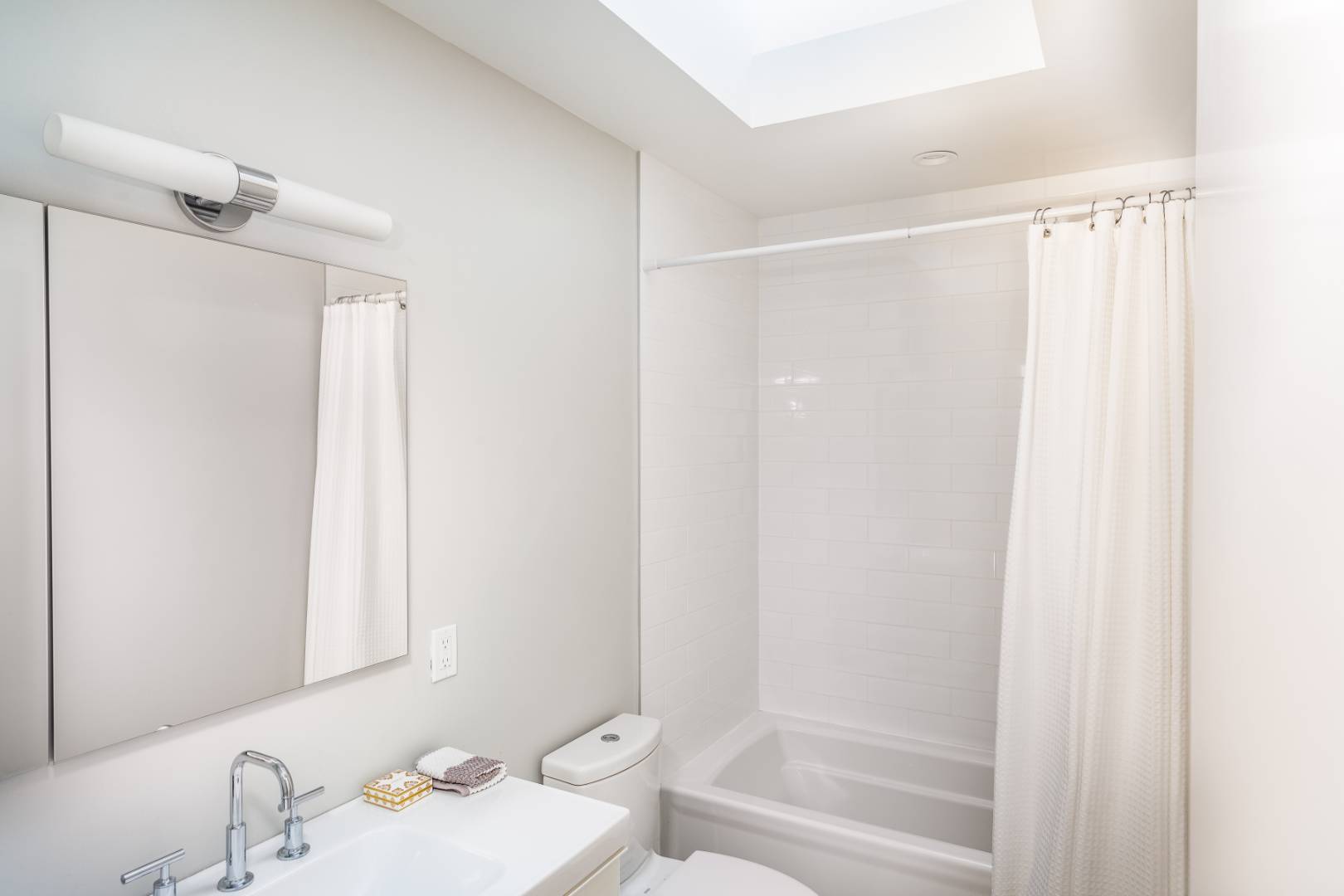 87 Accabonac Road East Hampton, NY 11937 - Photo 12 of 20 a bathroom with a sink and a mirror