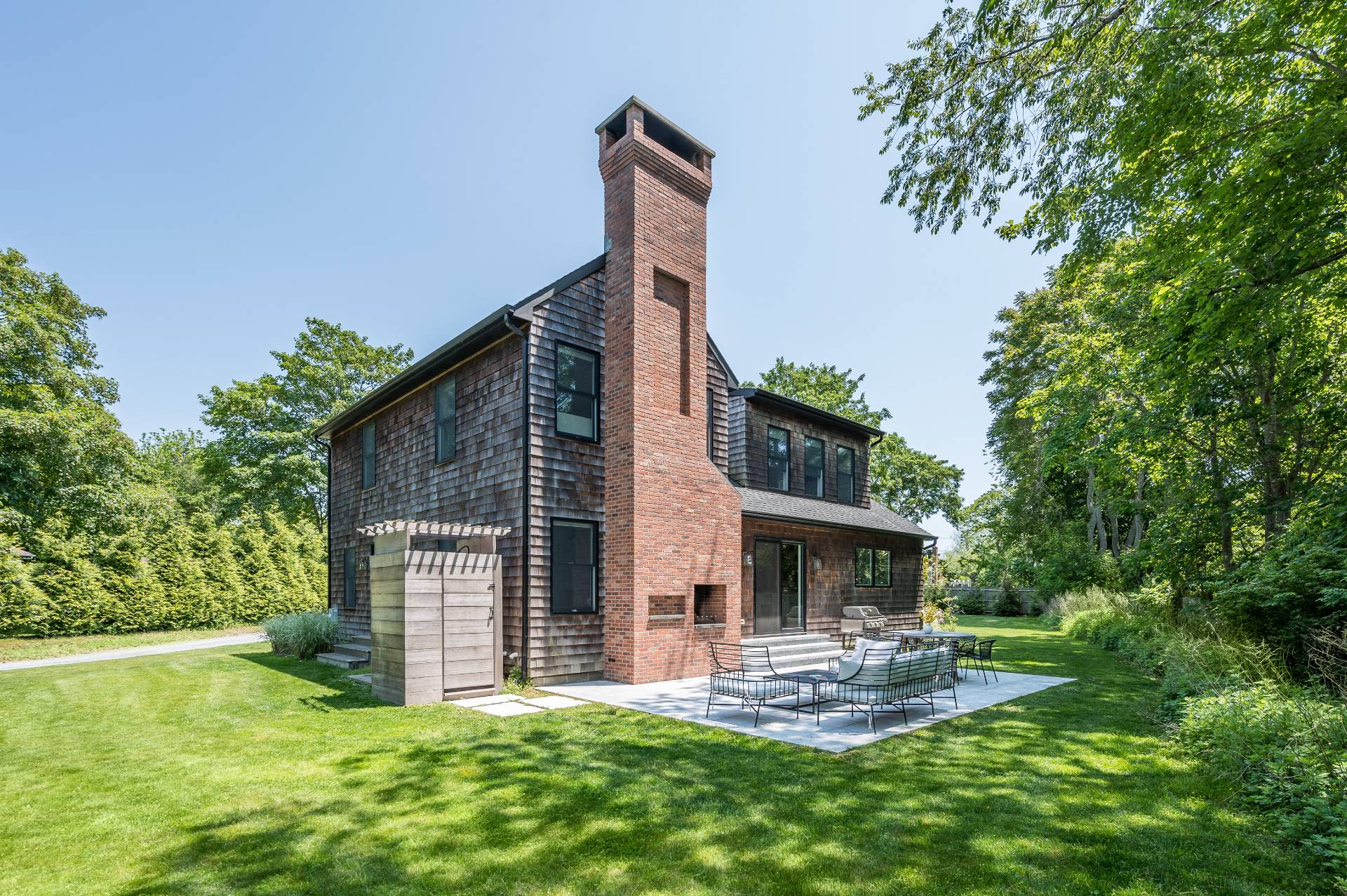 87 Accabonac Road East Hampton, NY 11937 - Photo 15 of 20 a view of a house with a yard and sitting area