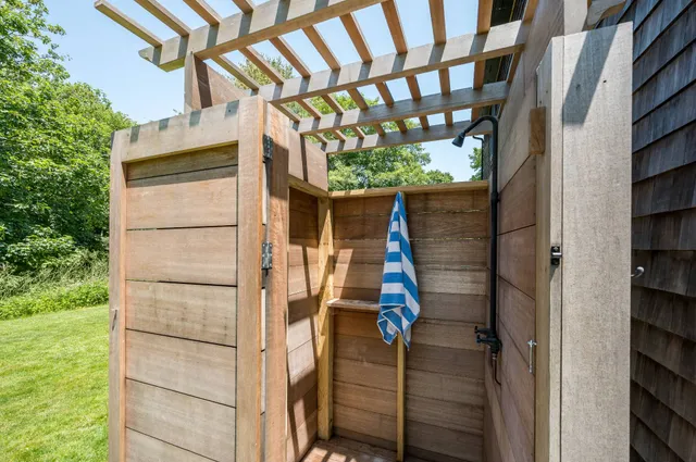 a yellow house with a outdoor space