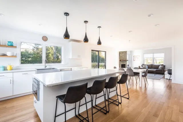 a kitchen with lots of counter space dining table and chairs