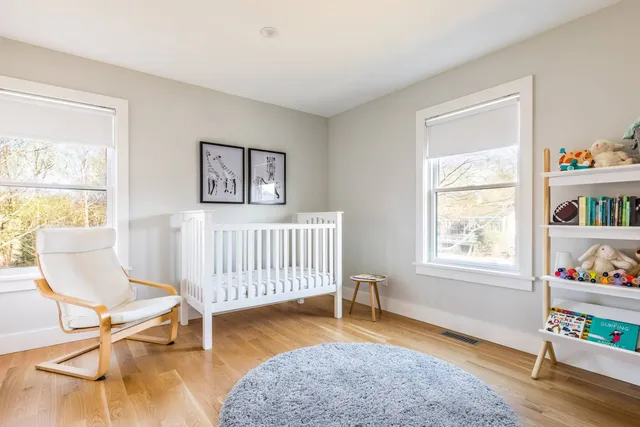 a bedroom with furniture and a window
