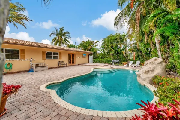 a view of a house with swimming pool