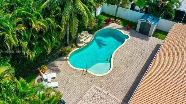 a view of swimming pool with a backyard
