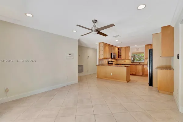 a kitchen with stainless steel appliances a refrigerator sink and cabinets