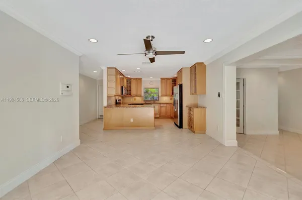 a large kitchen with cabinets and stainless steel appliances
