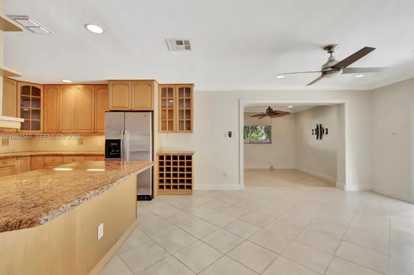 a view of kitchen with cabinets