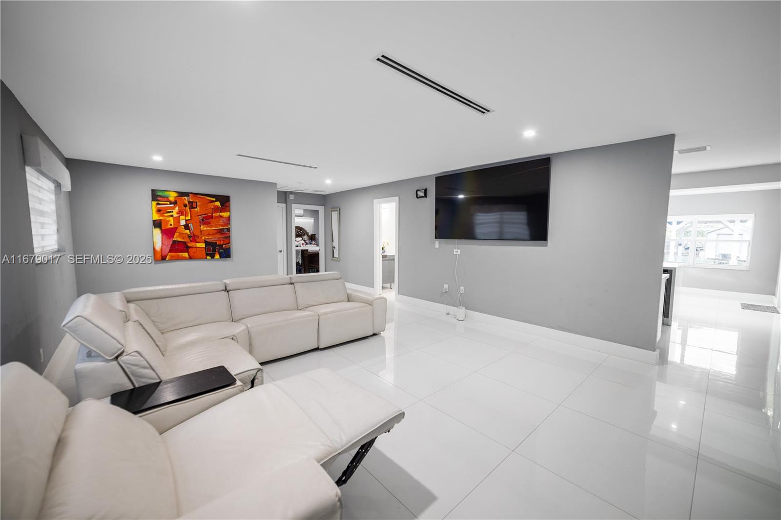 13550 Southwest 99th Place Miami, FL 33176 - Photo 13 of 25 a living room with furniture and a flat screen tv