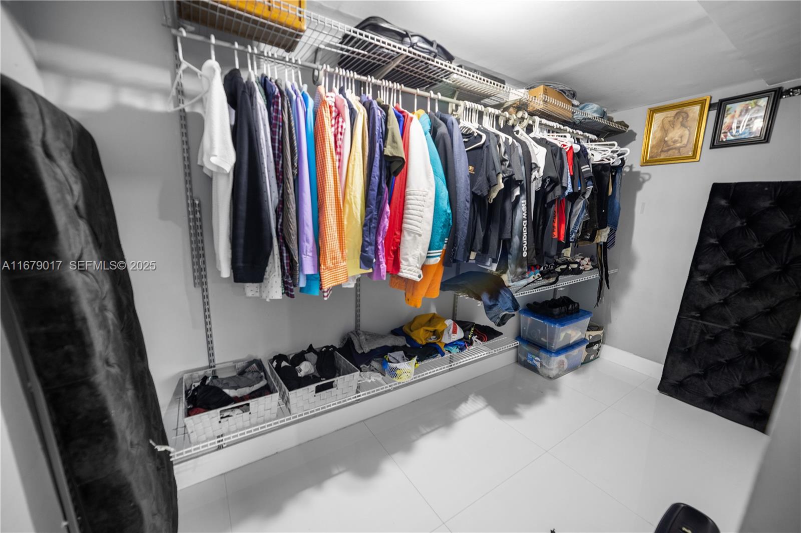 13550 Southwest 99th Place Miami, FL 33176 - Photo 17 of 25 a view of walk in closet with clothes