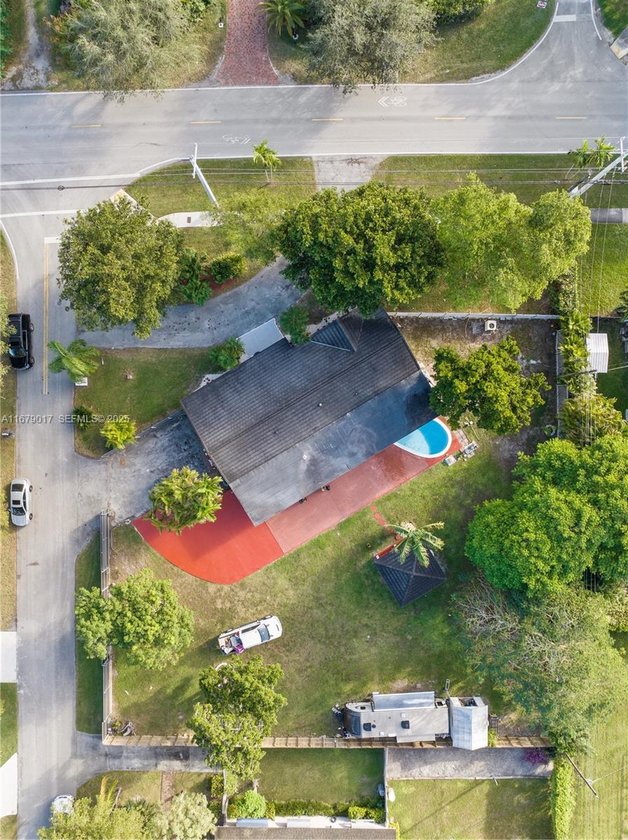 13550 Southwest 99th Place Miami, FL 33176 - Photo 2 of 25 an aerial view of a house with a yard