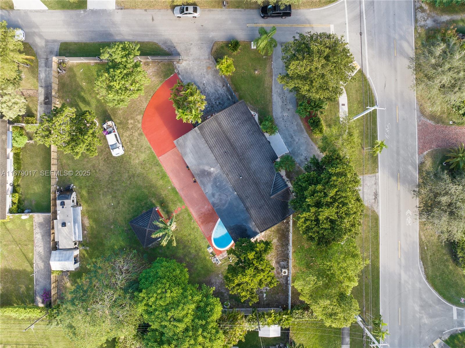13550 Southwest 99th Place Miami, FL 33176 - Photo 3 of 25 an aerial view of a house with a yard and a large tree