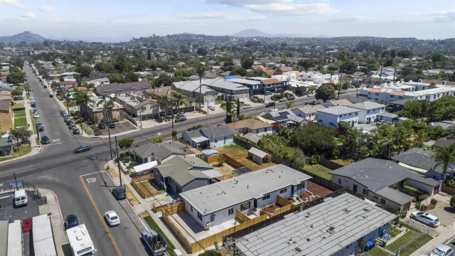 an aerial view of a city with lots of residential buildings