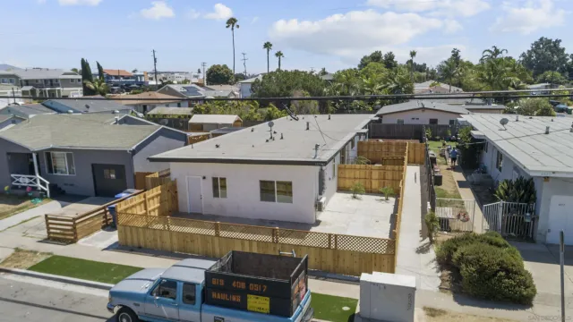 a aerial view of a house with swimming pool and furniture