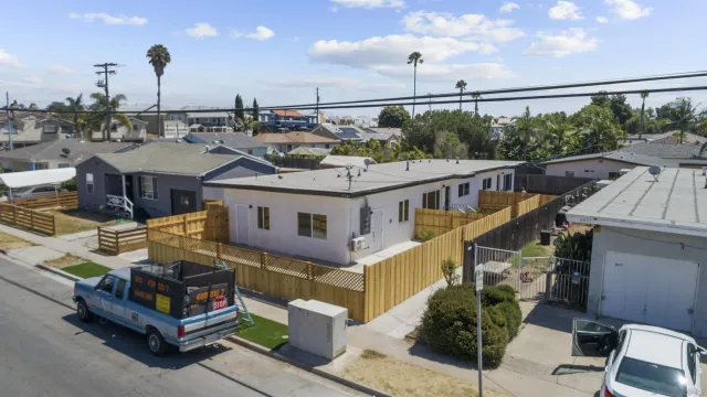 a view of a house with a floor to ceiling windows