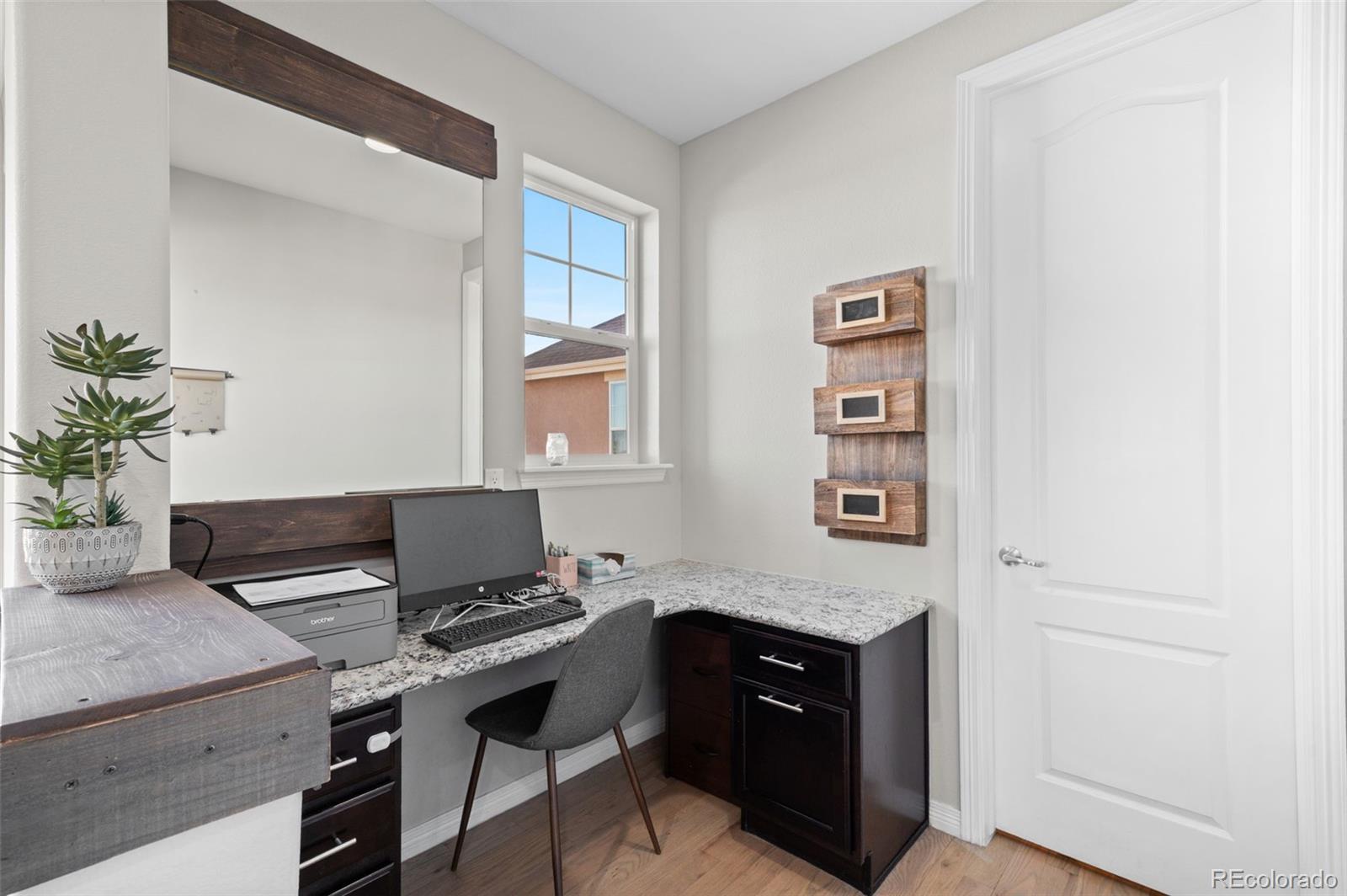 2910 El Nido Way Castle Rock, CO 80108 - Photo 14 of 50 a workspace with furniture and window