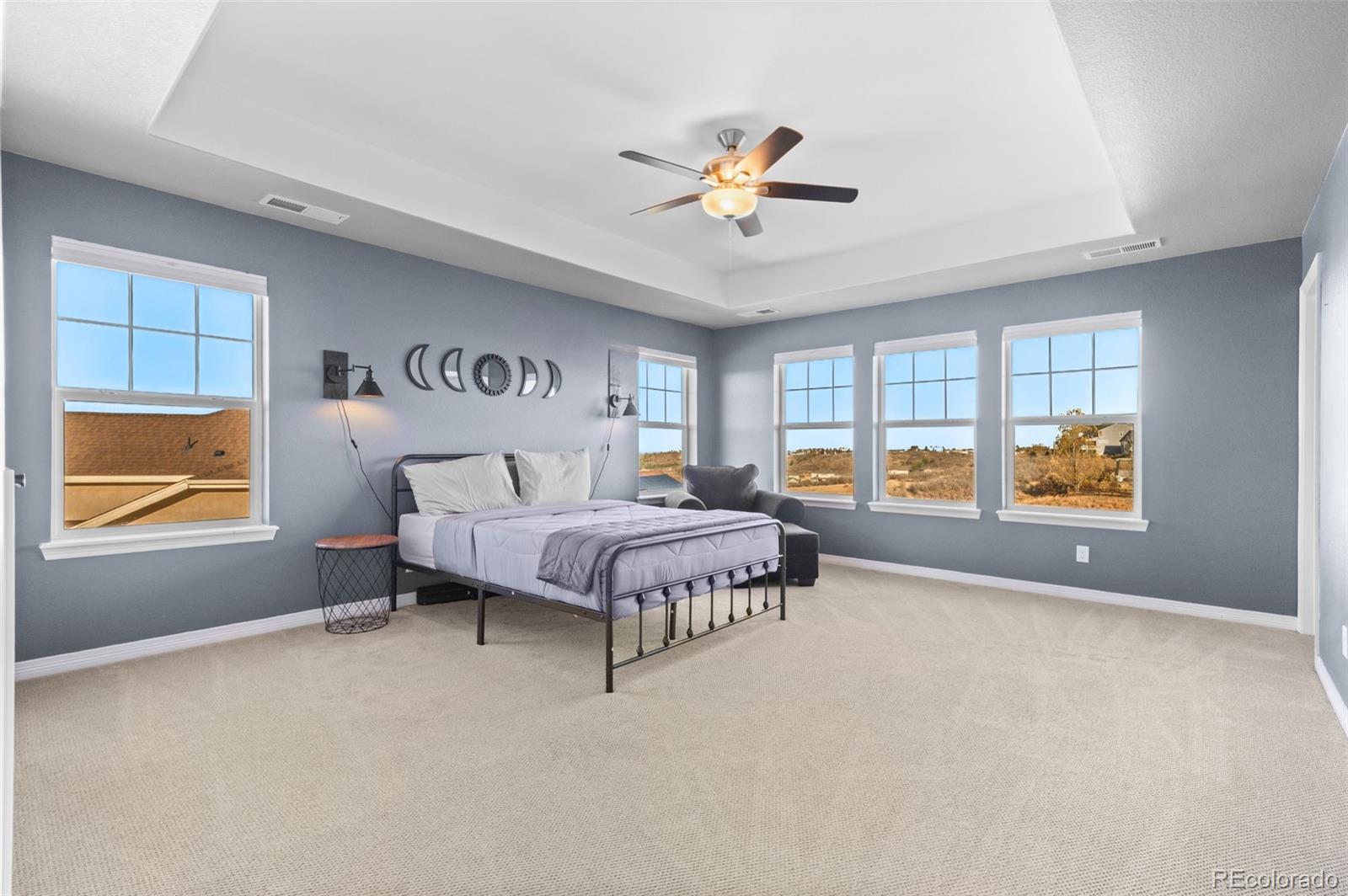 2910 El Nido Way Castle Rock, CO 80108 - Photo 19 of 50 a spacious bedroom with a bed and window