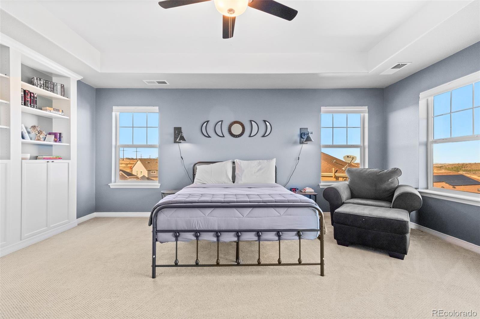 2910 El Nido Way Castle Rock, CO 80108 - Photo 20 of 50 a spacious bedroom with a bed and a couch