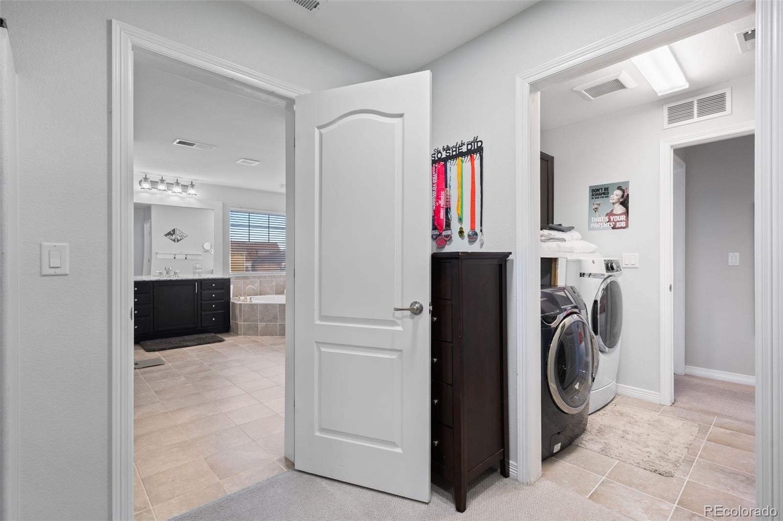 2910 El Nido Way Castle Rock, CO 80108 - Photo 25 of 50 a utility room with closet dryer and washer