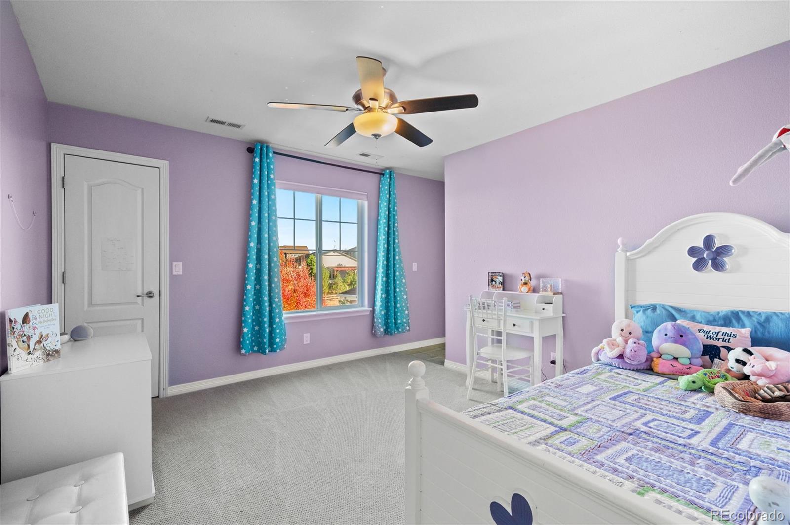 2910 El Nido Way Castle Rock, CO 80108 - Photo 26 of 50 a bedroom with a bed and dresser