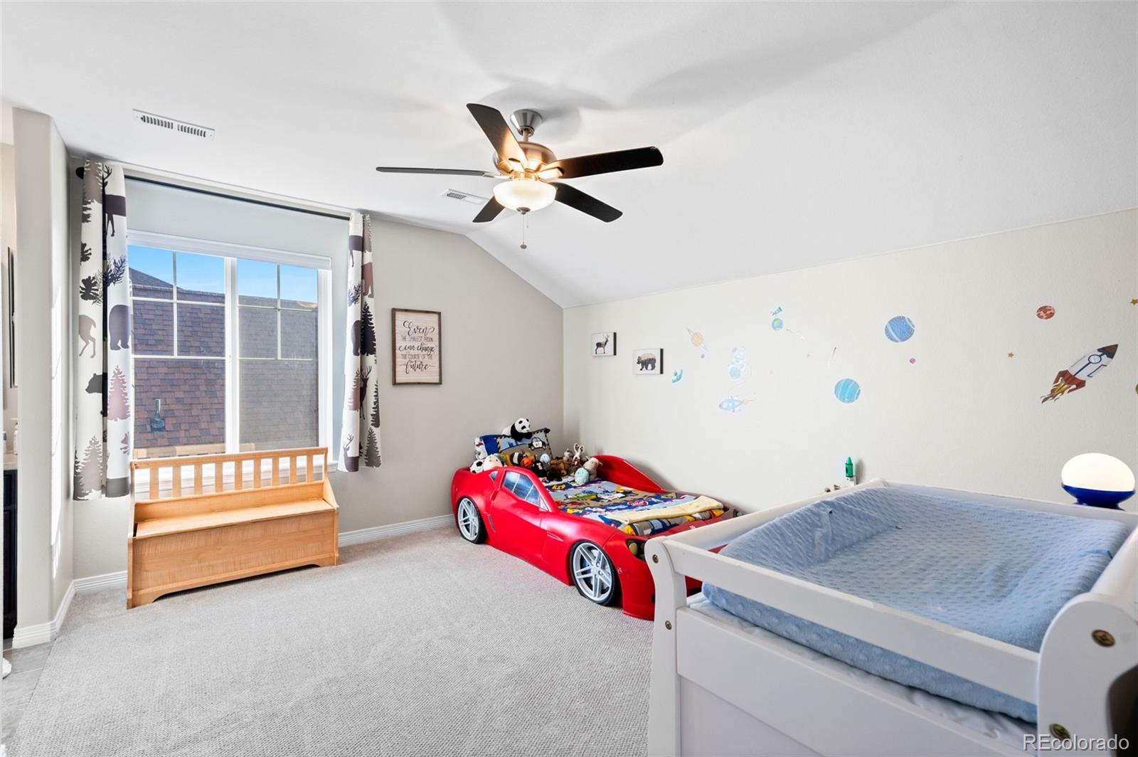 2910 El Nido Way Castle Rock, CO 80108 - Photo 28 of 50 a bedroom with a bed and a window
