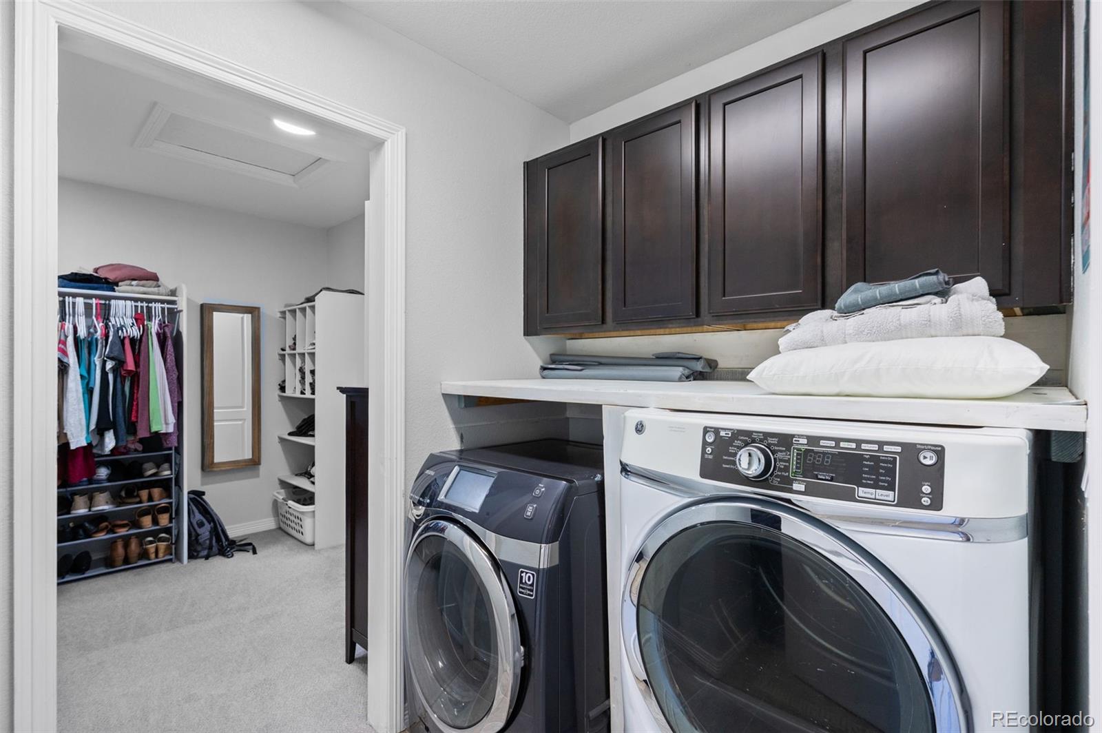 2910 El Nido Way Castle Rock, CO 80108 - Photo 30 of 50 a view of a livingroom with washer and dryer