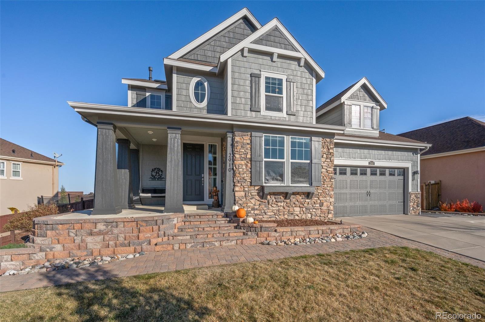 2910 El Nido Way Castle Rock, CO 80108 - Photo 3 of 50 a front view of a house with a yard
