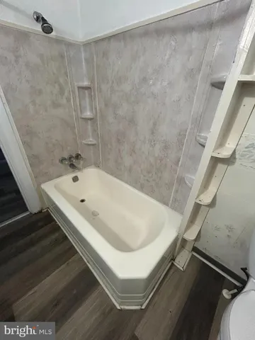 a bathroom with a white tub